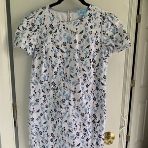 Draper James white denim dress with fringe hem.